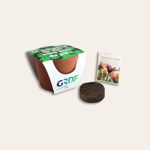 Pot terre cuite GRDF avec tourbe et sachet de graines.