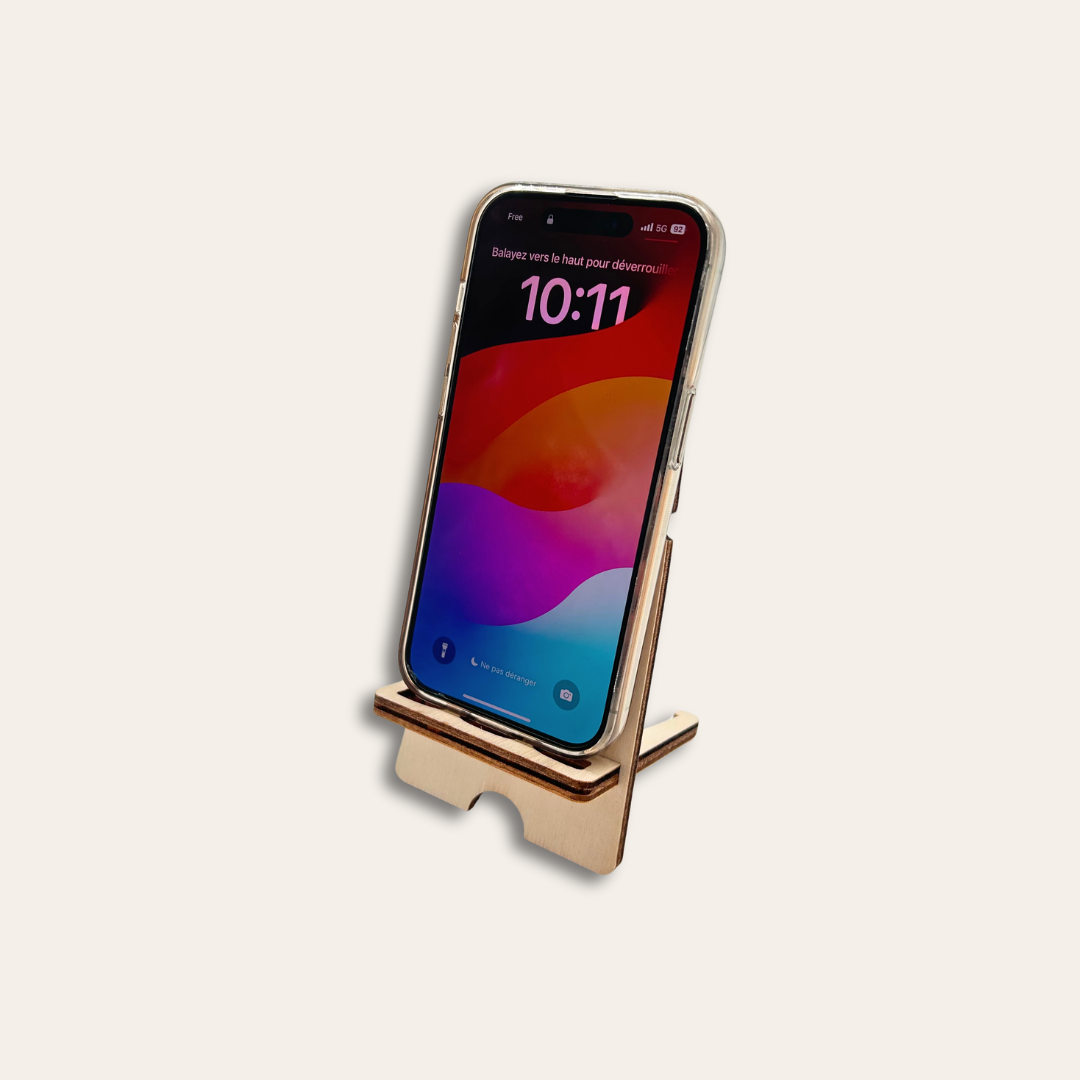 Support téléphone solidaire et made in France Support de téléphone et un mobile est posé dessus.