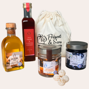 coffret solidaire version confiture myrtille coffret avec huile de noix, sirop fraise et fleur de cerisier, boules fourrées au miel et pot de confiture de myrtilles
