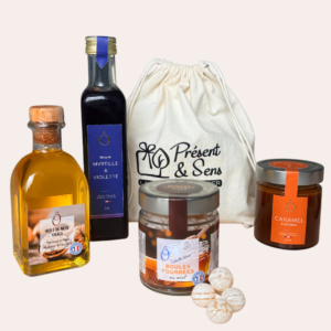 coffret solidaire version sirop myrtille-violette et caramel coffret avec huile de noix, sirop myrtille et violette, boules fourrées au miel et pot de caramel