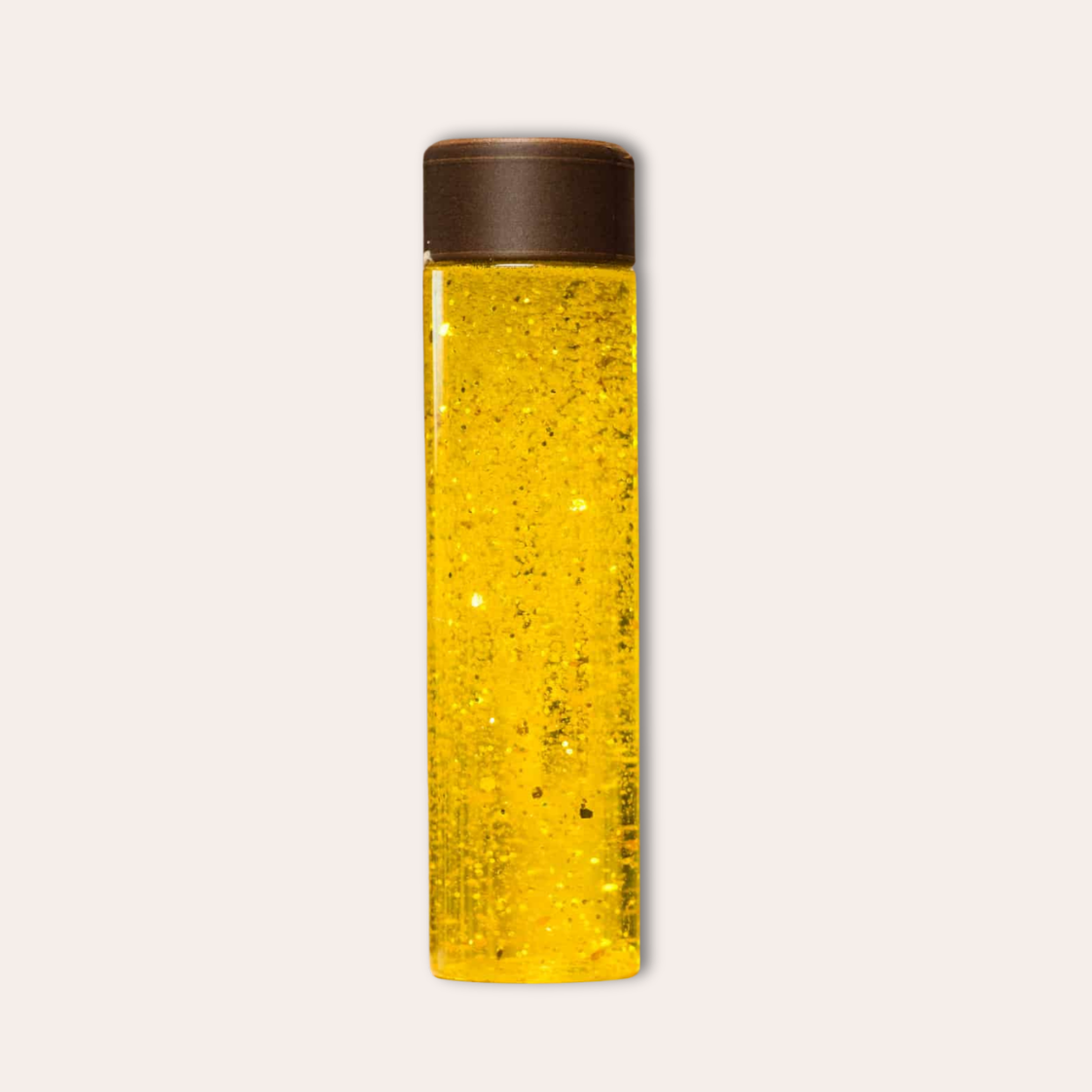 Bouteille sensorielle jaune foncée à paillettes